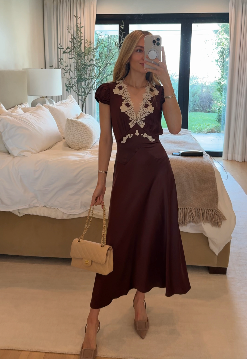 Elevate your wardrobe with the Coraline Dress by Dôen, crafted from luxurious silk satin for a graceful drape. This sophisticated midi dress showcases delicate scalloped lace along the neckline and intricate lace trim, enhancing its bohemian charm. The tie-detailed waist accentuates your silhouette, offering a refined yet effortless elegance perfect for any occasion.