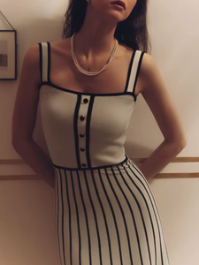 Elevate your evening with the Camille Midi Dress, a refined choice for sophisticated occasions. This slim, strapless design features contrasting stripes that artfully enhance its elegant silhouette. The backless cut adds a subtle allure, while the knit fabric ensures comfort and a flawless fit. Perfect for parties or upscale events, this dress combines modern style with timeless grace.
