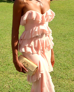 Elevate your style with the Oleksandra Maxi Dress. This luxurious dress features ruffled details and a daring open back, perfect for making a statement. Its flowy, sleeveless design and off-the-shoulder silhouette add a touch of elegance to any event. Be bold and stand out in this rose-colored dress.