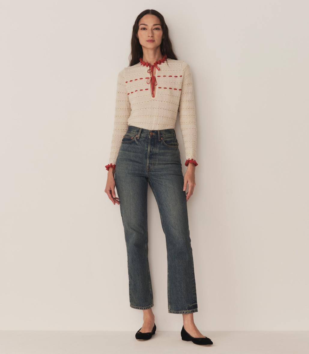Inspired by 1940s knitwear, the Cordelie Top in Moonstone features a luxurious blend of 80% baby alpaca and 20% silk for exceptional softness and warmth. Lightweight yet insulating, this layerable piece offers delicate sophistication with silk grosgrain ribbons that tie elegantly at the neck. Crafted in Peru with sheer opaque fabric, it combines refined heritage style with modern comfort for versatile wear.
