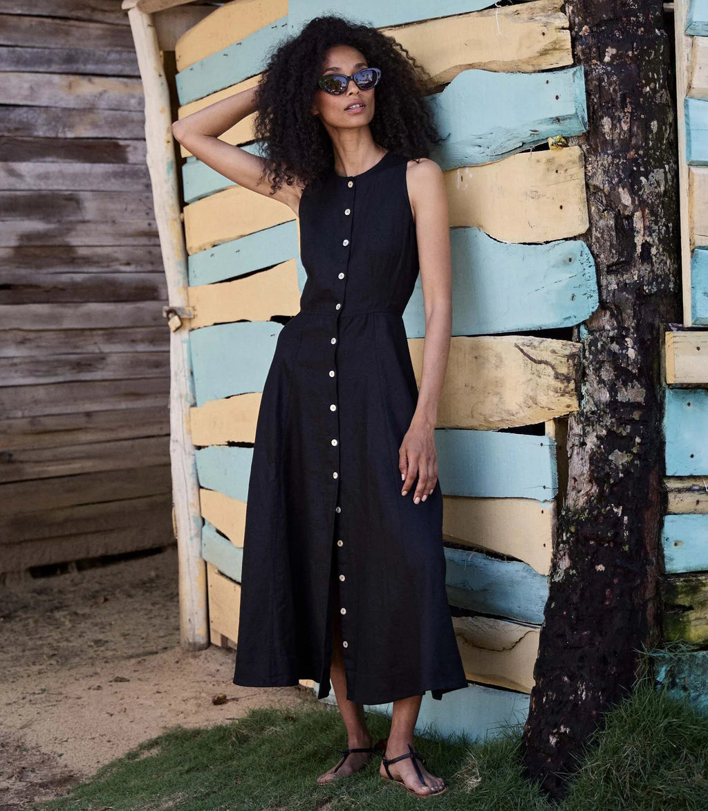 Elevate your style game with the Bryony Dress by Doen! Made with luxurious midweight linen, this '50s-inspired sleeveless dress features a flattering fitted bodice and a chic ankle-grazing length. Perfect for any occasion, it's time to update your wardrobe with this elegant and versatile piece.