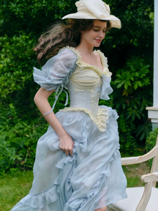 Introducing the Elora Dress - a vintage-inspired, slimming maxi dress in a sophisticated fishbone blue. With delicate lace accents and a seductive V-neck, this dress is perfect for summer parties and birthdays. Channel elegance and sexiness with every step in this exclusive piece.