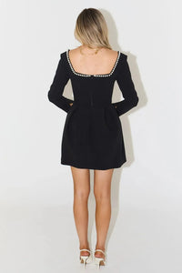 Indulge in luxury with the Pearl Mini Dress. Featuring a dramatic square neck line and a pearl trim from front to back, this dress is perfect for making a statement at any party. Elevate your style and confidence with this elegant and exclusive piece.