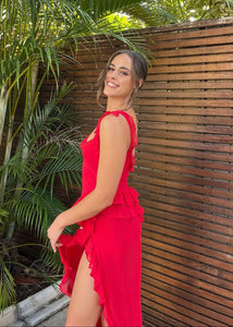 Discover elegance and sexiness in the Ariela Maxi Dress. Adorned with fluttery ruffles, this cherry-hued dress features a draped cowl neckline and a thigh high split for a floaty finish. Made from lightweight georgette, it effortlessly skims over your curves. Perfect for any special occasion.