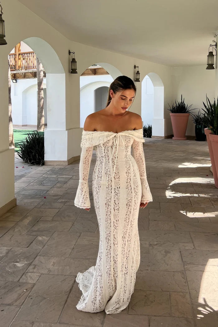 The Belle Maxi Dress offers a contemporary and classic design with a curve-creating silhouette. Made from stretch floral lace and featuring internal boning, it beautifully showcases your figure while providing elegant draping off the shoulder. The contrast lining adds an extra touch of sophistication.