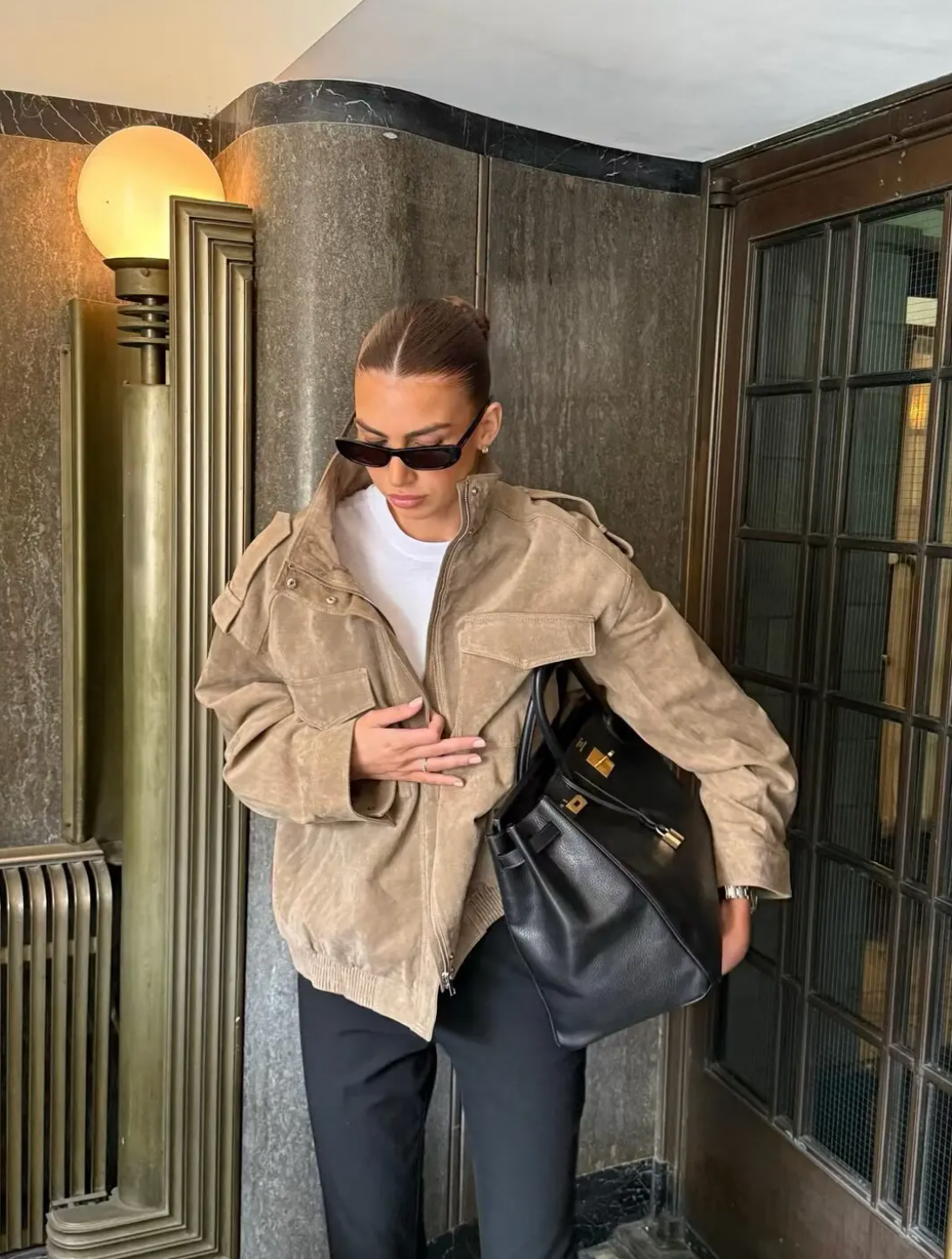 This Suede Jacket combines timeless sophistication with practical design. Crafted from soft suede leather, it features a high collar that provides extra warmth and a refined look. Long cuffed sleeves with shoulder tabs enhance its rugged appeal, while front and chest flap pockets offer convenient storage without sacrificing style. 