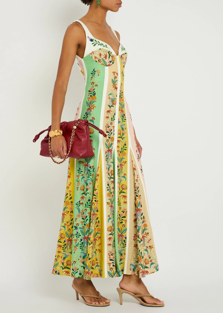 This sophisticated maxi dress from Farm Rio combines a linen-blend fabric with a delicate floral print and striking striped color-block panels. Featuring a flattering sweetheart neckline with a balconette-style bust, it offers an elegant silhouette. The concealed hook and zip fastening at the back ensures a seamless fit. Made from 55% linen and 45% viscose, this dress provides breathable comfort and graceful movement ideal for refined daytime or evening occasions.