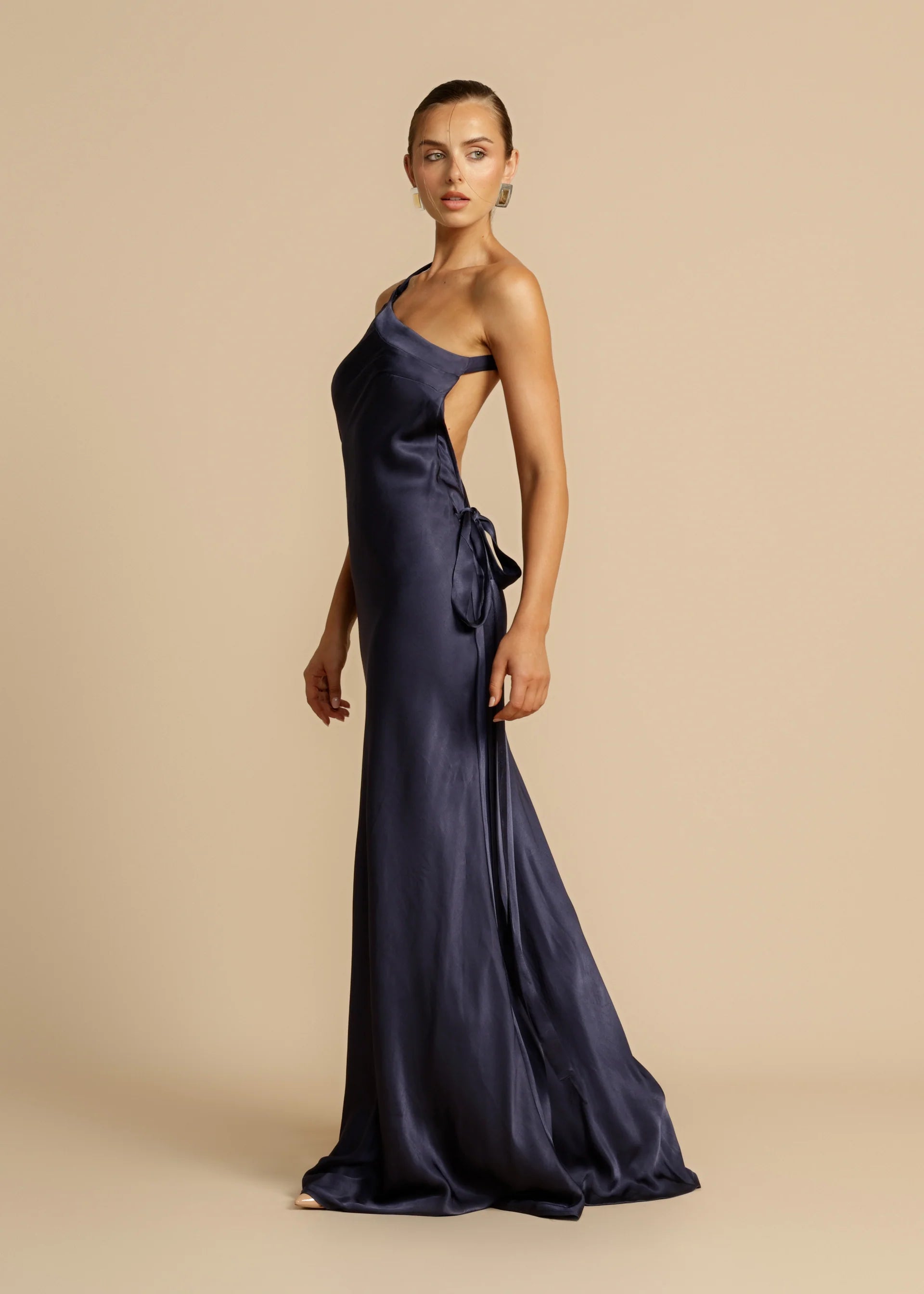 Experience modern elegance with Monique Maxi Dress. Made from luxurious, curve-enhancing viscose, this one-shoulder gown features a stunning open back and sophisticated crossover detailing. Perfect for starlit nights or glamorous events, unleash your inner diva and make a lasting impression with Monique.