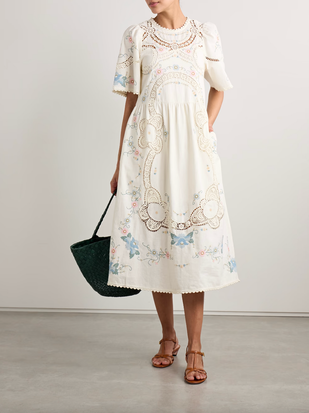 Crafted from a refined cotton and linen blend, the Vesna Linen Dress by SEA features delicate broderie anglaise trim and intricate embroidery, highlighting expert craftsmanship. Its midi length offers timeless elegance, while breathable fabrics ensure comfort in warmer weather. This dress effortlessly balances classic design with modern appeal, making it a versatile addition to a sophisticated wardrobe.
