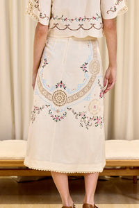 Indulge your senses in the Edwina Embroidery Skirt by SEA. With its intricate cross stitch embroidery and crochet trim detailing, this skirt exudes sophistication and luxury. Made with a blend of cotton and linen, and featuring a slim fit design, it is both stylish and comfortable. Complete the look with the invisible back zipper and a 100% cotton lining for a flawless finish.