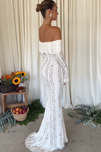 The Belle Maxi Dress offers a contemporary and classic design with a curve-creating silhouette. Made from stretch floral lace and featuring internal boning, it beautifully showcases your figure while providing elegant draping off the shoulder. The contrast lining adds an extra touch of sophistication.