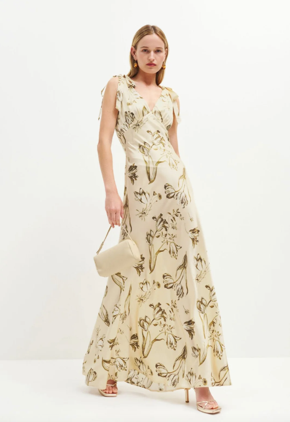 The Pernille Silk Dress exudes understated elegance with its delicate tie straps and flattering v-neck design. Crafted from lightweight silk charmeuse, it offers a graceful drape and subtle sheen. The Ivory colorway features a more substantial, higher-quality silk, lending a richer feel and justifying its exclusive price. This refined piece promises timeless sophistication for those who appreciate exquisite craftsmanship and luxurious fabric.