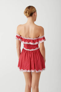 Elevate your evening look with the Charli Mini Dress in Scarlet Dot by Frankies Bikinis. Made of silk-like fabric, this off-the-shoulder dress features a smocked back and corset waist for a sultry silhouette. Vintage-inspired lace accents and lace trim add a touch of elegance, while the elastic neckline ensures a comfortable fit. Perfect for any special occasion.