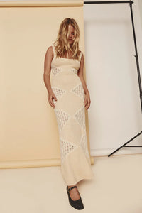 The Eliana Knit Maxi Dress features a distinctive two toned knit technique, adding depth and texture to the fabric. The result is a stylish and elegant dress that is both unique and versatile. The knit design also offers a subtle sheer effect, adding a touch of allure to the overall look. Elevate your wardrobe with this luxurious and sophisticated maxi dress.