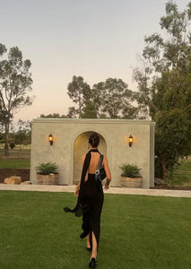 The Amber Maxi Dress by Helsa Studio combines refined elegance with bold design. Featuring a sculpted silhouette and delicate draping, it flatters the figure while the halter neckline and sheer scarf add refined sophistication. The flared hem enhances graceful movement, complemented by a sheer bodice that introduces a confident, modern edge. Perfect for special occasions, this dress delivers a distinctive and memorable style with expert craftsmanship.