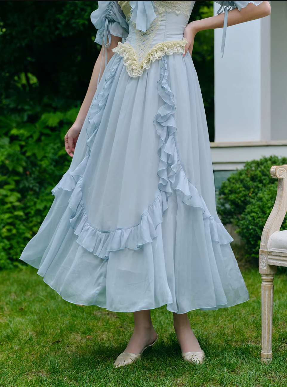Introducing the Elora Dress - a vintage-inspired, slimming maxi dress in a sophisticated fishbone blue. With delicate lace accents and a seductive V-neck, this dress is perfect for summer parties and birthdays. Channel elegance and sexiness with every step in this exclusive piece.