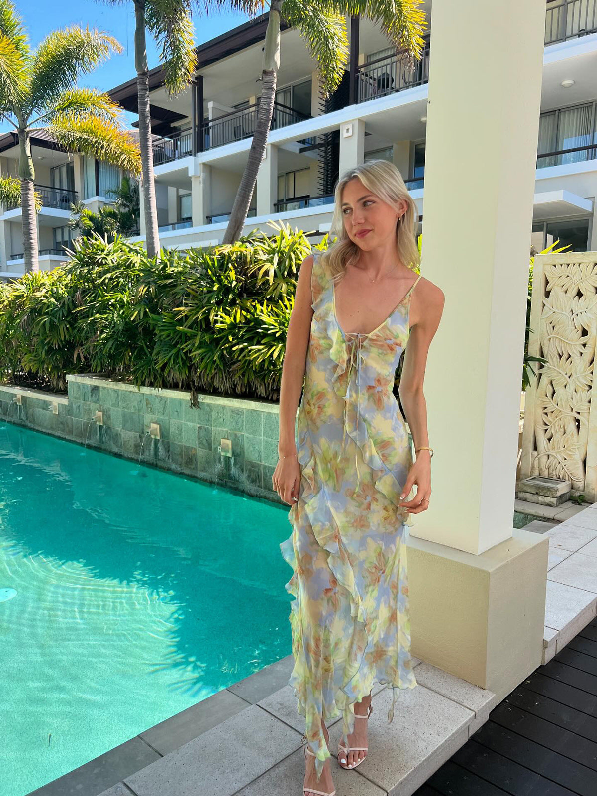 Crafted from lustrous silk print fabric and cut on the bias, the Courtney Frill Maxi Dress by Bec + Bridge embodies sophisticated ease. This statement piece showcases a plunging V-neckline, asymmetrical raw-cut shoulder detail, and artfully placed raw-cut ruffles that create movement and visual interest. The lace-up front closure and open V-back add architectural intrigue, making this an ideal choice for those seeking refined elegance with contemporary edge.