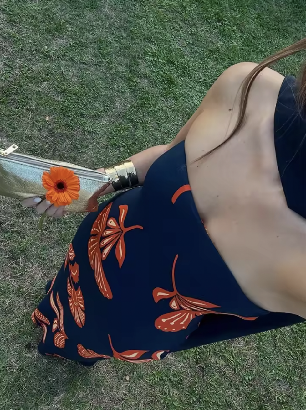 Embrace elegance with the Orfila Manila Maxi Dress, featuring a strapless floral print that captures the essence of summer sophistication. Its sleeveless, backless design paired with a flowing silhouette offers a flattering, graceful fit perfect for beach parties or evening events. Complete with a coordinating scarf, this dress combines comfort and style for unforgettable holiday moments.