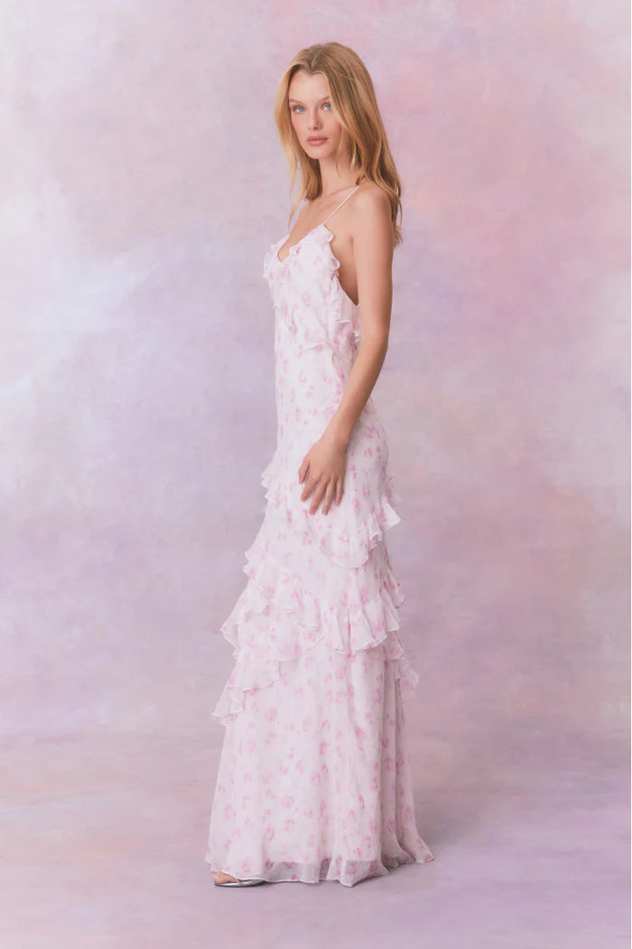 Designed with elegance and movement in mind, the Rialto Maxi Dress in Sterling Dust captivates with its chiffon fabric and cascading asymmetrical ruffles that flow from neckline to hem. Its slightly fitted silhouette enhances your figure with subtle allure, while a discreet side seam zipper ensures a seamless fit. Perfect for dancing or any refined occasion, this dress combines comfort with sophisticated style effortlessly.