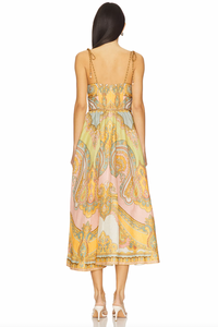 The Maxine Picnic Midi Dress by Zimmermann features a boned bodice with a smocked back for a tailored yet flexible fit. Crafted from lightweight linen, it ensures breathable comfort during warm days. The unlined design pairs with self-tie shoulder straps and a hidden back zipper closure for a sleek silhouette. Functional side seam pockets add practicality without compromising style, making this dress an expert choice for effortless, elegant summer wear.