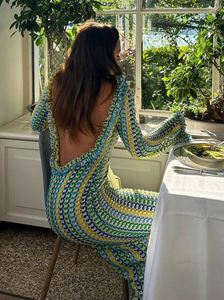 The Isla Maxi Dress is the perfect addition to your summer wardrobe. Crafted with a crochet knit and a stylish open back, this dress offers a fitted silhouette and bell sleeves for a trendy look. Ideal for beach vacations, it's a must-have for any fashion-forward woman.