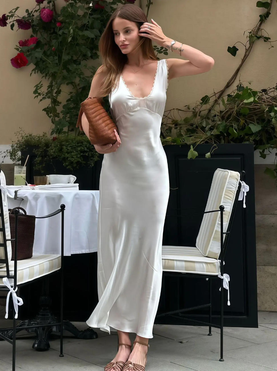 Elevate your evening look with the Allegra Satin Dress, a sleeveless, slim-fit gown designed to flatter your silhouette. Crafted from smooth satin, it features an elegant lace V-neckline and a high waist that enhances your figure. Perfect for sophisticated parties and special occasions, this dress combines timeless style with a touch of sensuality for a truly captivating presence.