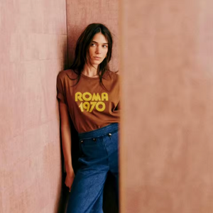 Elevate your casual wardrobe with the Roma 1970 Vintage T-Shirt—crafted from soft, breathable cotton for lasting comfort. Featuring a timeless brown hue and elegant letter-print design, this short-sleeve crewneck offers a relaxed fit that effortlessly blends vintage charm with modern sophistication. Ideal for women seeking understated style with a classic touch.