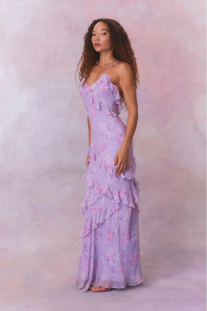 Designed with elegance and movement in mind, the Rialto Maxi Dress in Hibiscus captivates with its chiffon fabric and cascading asymmetrical ruffles that flow from neckline to hem. Its slightly fitted silhouette enhances your figure with subtle allure, while a discreet side seam zipper ensures a seamless fit. Perfect for dancing or any refined occasion, this dress combines comfort with sophisticated style effortlessly.