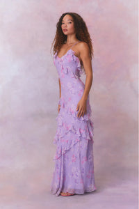Designed with elegance and movement in mind, the Rialto Maxi Dress in Hibiscus captivates with its chiffon fabric and cascading asymmetrical ruffles that flow from neckline to hem. Its slightly fitted silhouette enhances your figure with subtle allure, while a discreet side seam zipper ensures a seamless fit. Perfect for dancing or any refined occasion, this dress combines comfort with sophisticated style effortlessly.