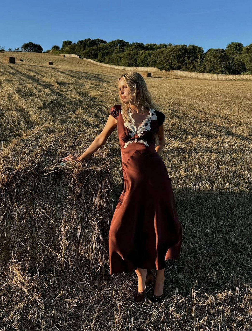 Elevate your wardrobe with the Coraline Dress by Dôen, crafted from luxurious silk satin for a graceful drape. This sophisticated midi dress showcases delicate scalloped lace along the neckline and intricate lace trim, enhancing its bohemian charm. The tie-detailed waist accentuates your silhouette, offering a refined yet effortless elegance perfect for any occasion.