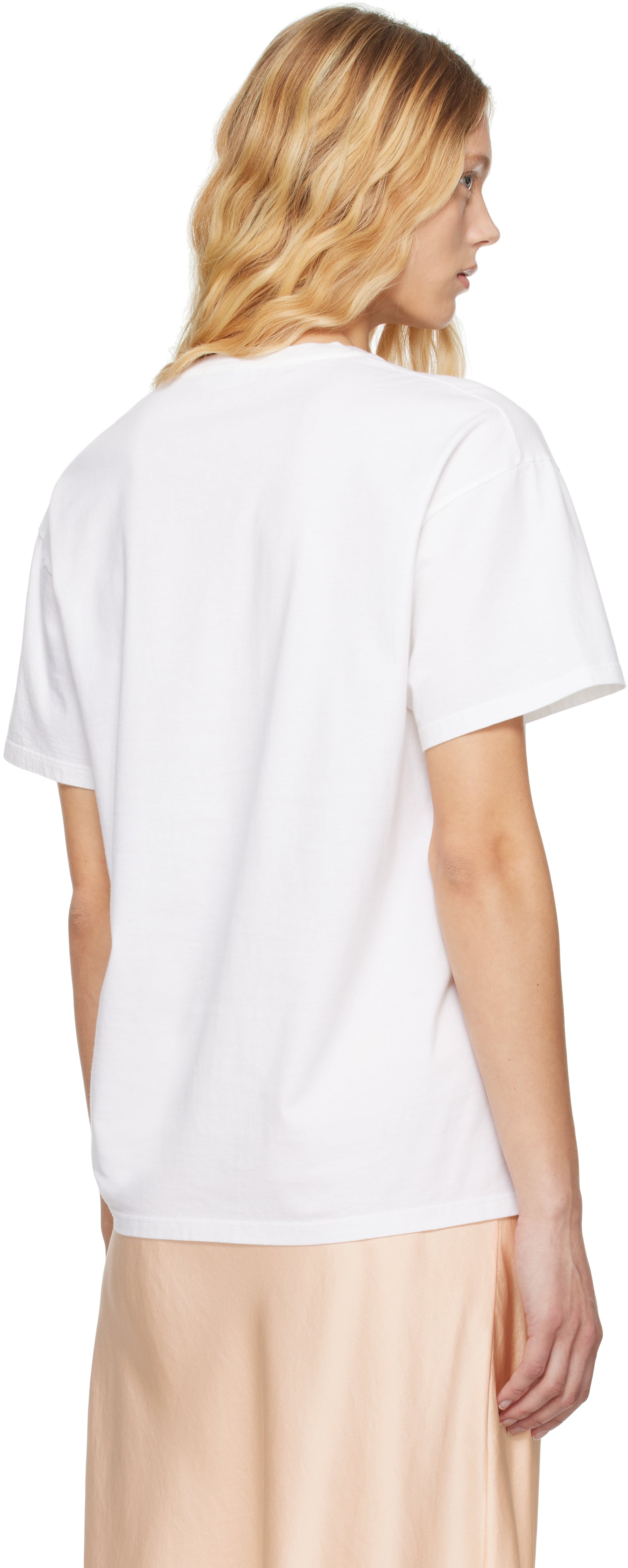 The White Nadina Oversized Short-Sleeve Top by The Row is expertly crafted from soft white cotton, balancing comfort with sophisticated design. Its classic crew neckline and short sleeves complement the clean, straight hem, while the oversized fit provides relaxed ease enhanced by subtle ribbed detailing for added texture and structure. This versatile tee offers a refined, effortless aesthetic, perfect for layering or standalone wear.