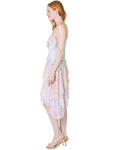 Indulge in luxury with the Newport Silk Midi Dress by LoveShackFancy. Made from 100% silk, this dress boasts a unique floral print and a flattering faux wrap design with ruffles at the neckline and hem. With adjustable spaghetti straps, this dress is perfect for any occasion. Elevate your wardrobe with the Newport Dress!