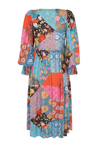 The Cha Cha Boho Midi Dress by Spell combines breathable, lightweight fabric with a refined design for ultimate comfort in warm weather. Its pull-on style and partial button front simplify dressing, while the tasseled tie neckline and cinched ruffled cuffs create a subtle, elegant bohemian aesthetic. This dress is an expert choice for those prioritizing both comfort and sophisticated style in their wardrobe.