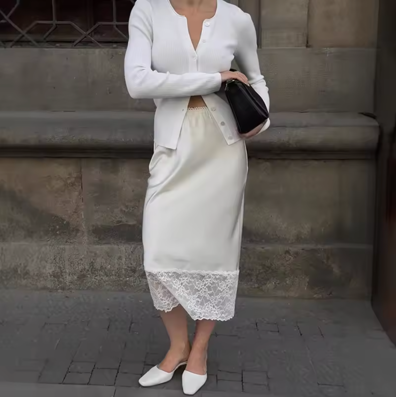 Elevate your wardrobe with the Margot Lace Skirt, an elegant satin piece designed for the modern professional woman. Featuring a high waist and graceful lace splice detail, this long skirt combines sophistication with comfort, ideal for summer wear. Its refined silhouette enhances your figure while maintaining a polished look suitable for any formal or business setting. The breathable satin fabric ensures all-day comfort, making it a versatile addition to your seasonal collection.