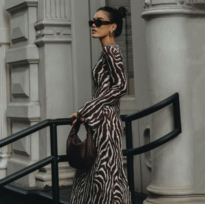 Indulge in the beauty of nature with the Zebra Maxi Dress! Featuring a beautiful floral print and transparent mesh detailing, this dress is perfect for any summer party. The round neckline and flowy design add a touch of elegance and fashion to your wardrobe. Elevate your style with this must-have dress!