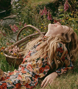 Crafted from washed silk crepe de chine, the Musetta Dress in Poppy Meadow by Doen combines elegance with refined tailoring. It features a sophisticated mock neck and dramatic flared sleeves finished with delicate ruffle trims at the cuffs. The fitted bodice, enhanced by an invisible side zipper, seamlessly flows into an ankle-grazing bias-cut skirt, ensuring a flattering silhouette and graceful movement. Ideal for those seeking timeless style with subtle, expert detailing.