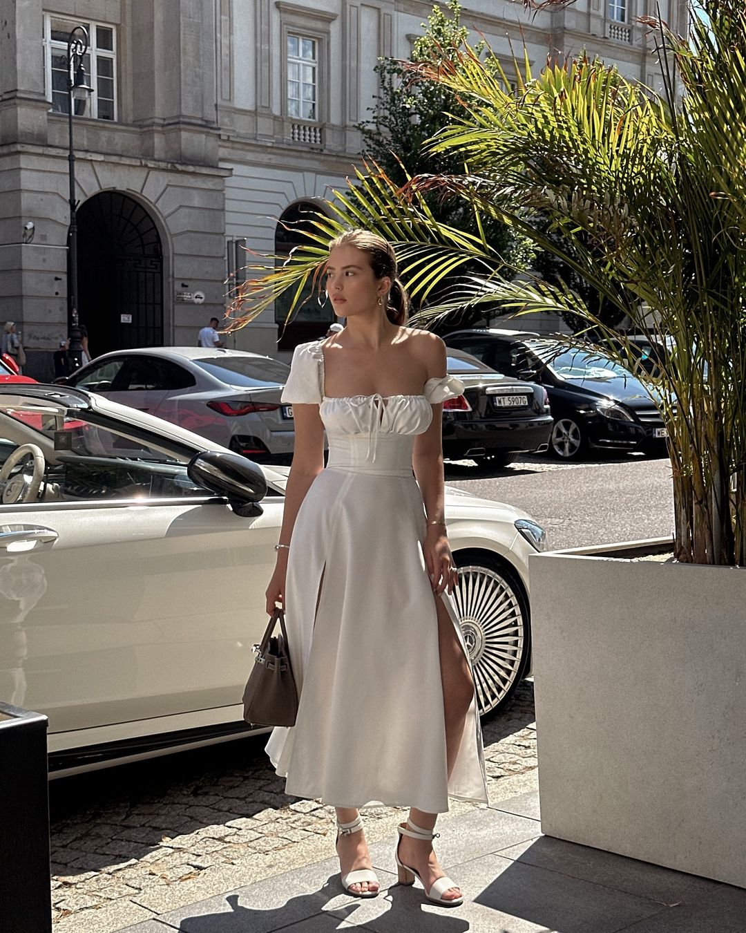 Discover the perfect blend of French elegance and vacation vibes with our Lea Midi Dress. Made with high-end, black fabric, this dress features puffy sleeves and a side slit that will make you the best dressed this summer. Don't miss out on this best-selling dress for any occasion.