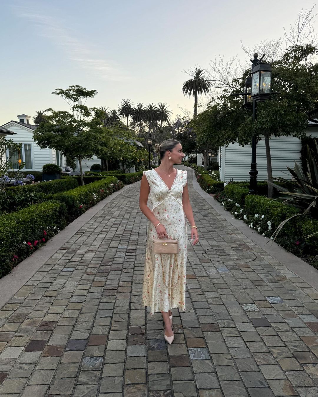 Introducing the Gigi Dress. Crafted from silky smooth fabric and cut on the bias, this dress drapes delicately on your frame. Inspired by nostalgia and femininity, this dress is perfect for a romantic evening or a carefree stroll through the orchard. Embrace the versatility of the Gigi midi dress.