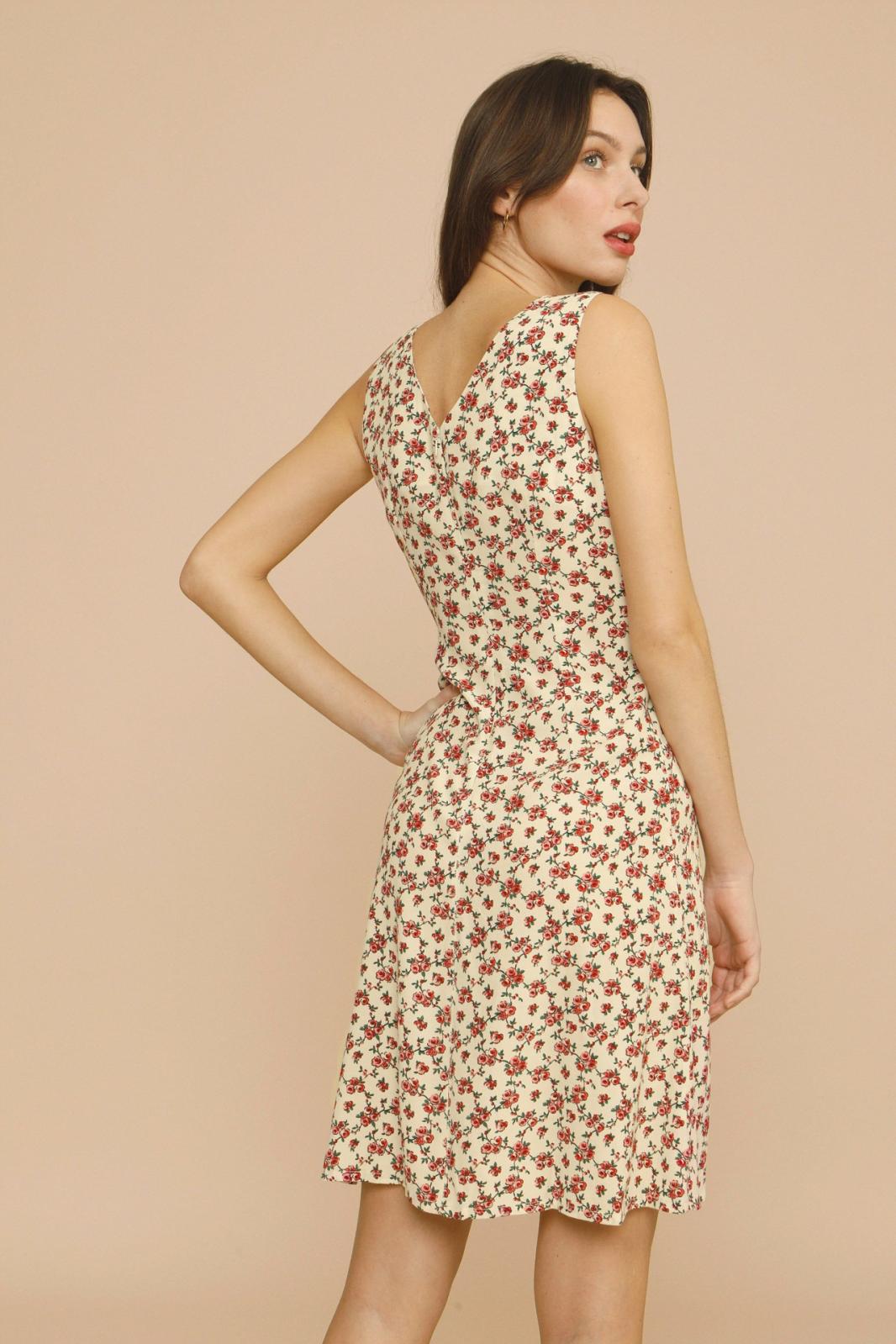 The Silvia Dress by Rouje is a sophisticated midi-length design featuring strategic chest cutouts and a flattering V-neckline at both front and back. Tailored for a precise fit, it secures with a discreet zip and hook fastenings at the back, combining elegance with ease of wear. Perfect for those seeking a refined yet contemporary silhouette.