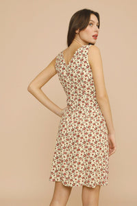 The Silvia Dress by Rouje is a sophisticated midi-length design featuring strategic chest cutouts and a flattering V-neckline at both front and back. Tailored for a precise fit, it secures with a discreet zip and hook fastenings at the back, combining elegance with ease of wear. Perfect for those seeking a refined yet contemporary silhouette.