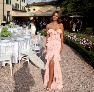 Elevate your style with the Oleksandra Maxi Dress. This luxurious dress features ruffled details and a daring open back, perfect for making a statement. Its flowy, sleeveless design and off-the-shoulder silhouette add a touch of elegance to any event. Be bold and stand out in this rose-colored dress.