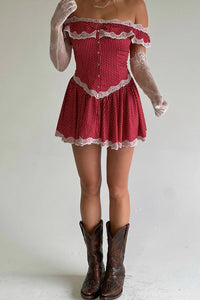 Elevate your evening look with the Charli Mini Dress in Scarlet Dot by Frankies Bikinis. Made of silk-like fabric, this off-the-shoulder dress features a smocked back and corset waist for a sultry silhouette. Vintage-inspired lace accents and lace trim add a touch of elegance, while the elastic neckline ensures a comfortable fit. Perfect for any special occasion.