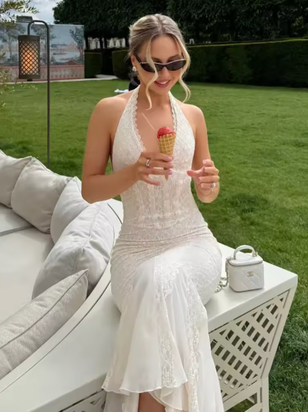 This halterneck corset lace dress combines elegance with allure through its deep V neckline and sleeveless, backless design. Crafted to accentuate the waist, the bodycon fit highlights your silhouette, while the fishtail hem adds a graceful, flowing finish. Perfect for sophisticated occasions, this long maxi gown offers a striking balance of classic lace details and modern shape.