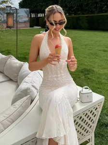 This halterneck corset lace dress combines elegance with allure through its deep V neckline and sleeveless, backless design. Crafted to accentuate the waist, the bodycon fit highlights your silhouette, while the fishtail hem adds a graceful, flowing finish. Perfect for sophisticated occasions, this long maxi gown offers a striking balance of classic lace details and modern shape.