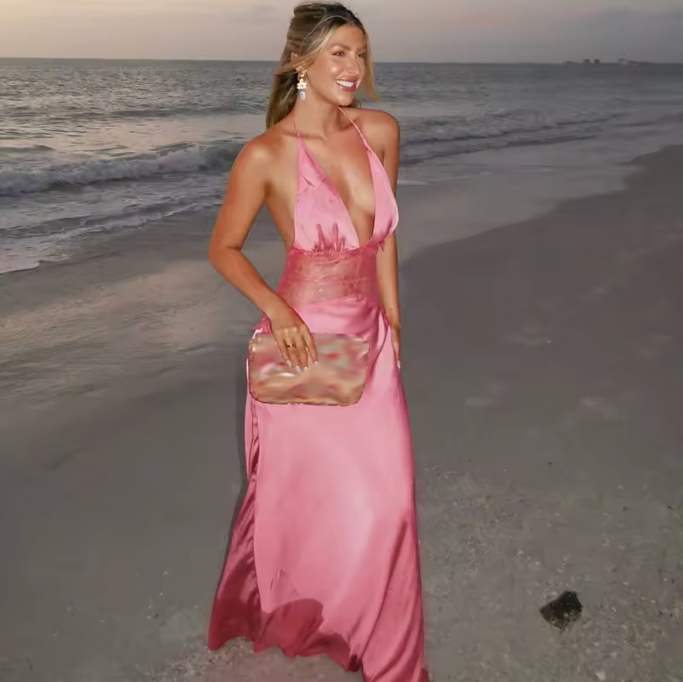 The Dinah Satin Dress offers a refined blend of elegance and allure with its halter tie V-neckline and softly gathered bust. Crafted with a sheer lace body that gracefully follows your silhouette, it features a dramatic low back and a maxi length for timeless sophistication. Partially lined and equipped with an invisible zip, this dress ensures a flawless fit and subtle coverage, perfect for making a confident statement at any special occasion.