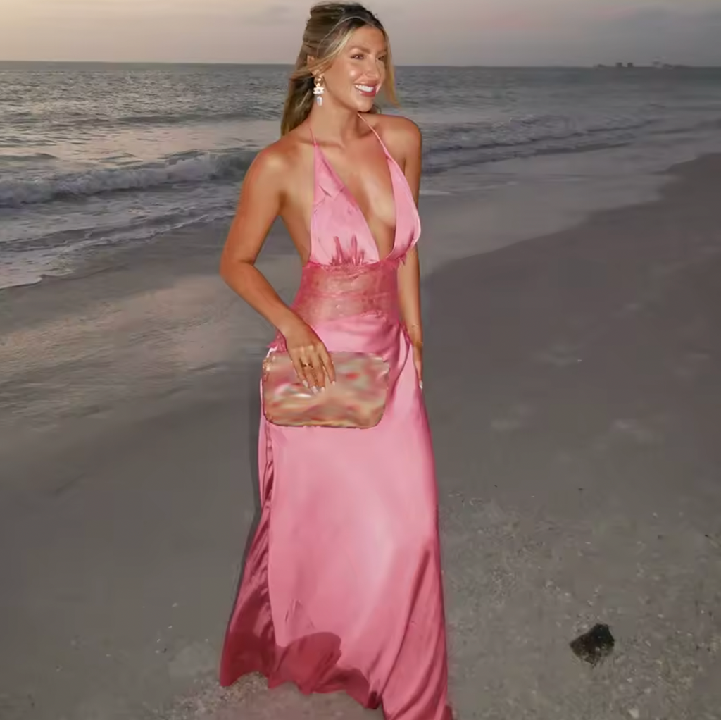 The Dinah Satin Dress offers a refined blend of elegance and allure with its halter tie V-neckline and softly gathered bust. Crafted with a sheer lace body that gracefully follows your silhouette, it features a dramatic low back and a maxi length for timeless sophistication. Partially lined and equipped with an invisible zip, this dress ensures a flawless fit and subtle coverage, perfect for making a confident statement at any special occasion.