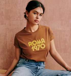 Elevate your casual wardrobe with the Roma 1970 Vintage T-Shirt—crafted from soft, breathable cotton for lasting comfort. Featuring a timeless brown hue and elegant letter-print design, this short-sleeve crewneck offers a relaxed fit that effortlessly blends vintage charm with modern sophistication. Ideal for women seeking understated style with a classic touch.