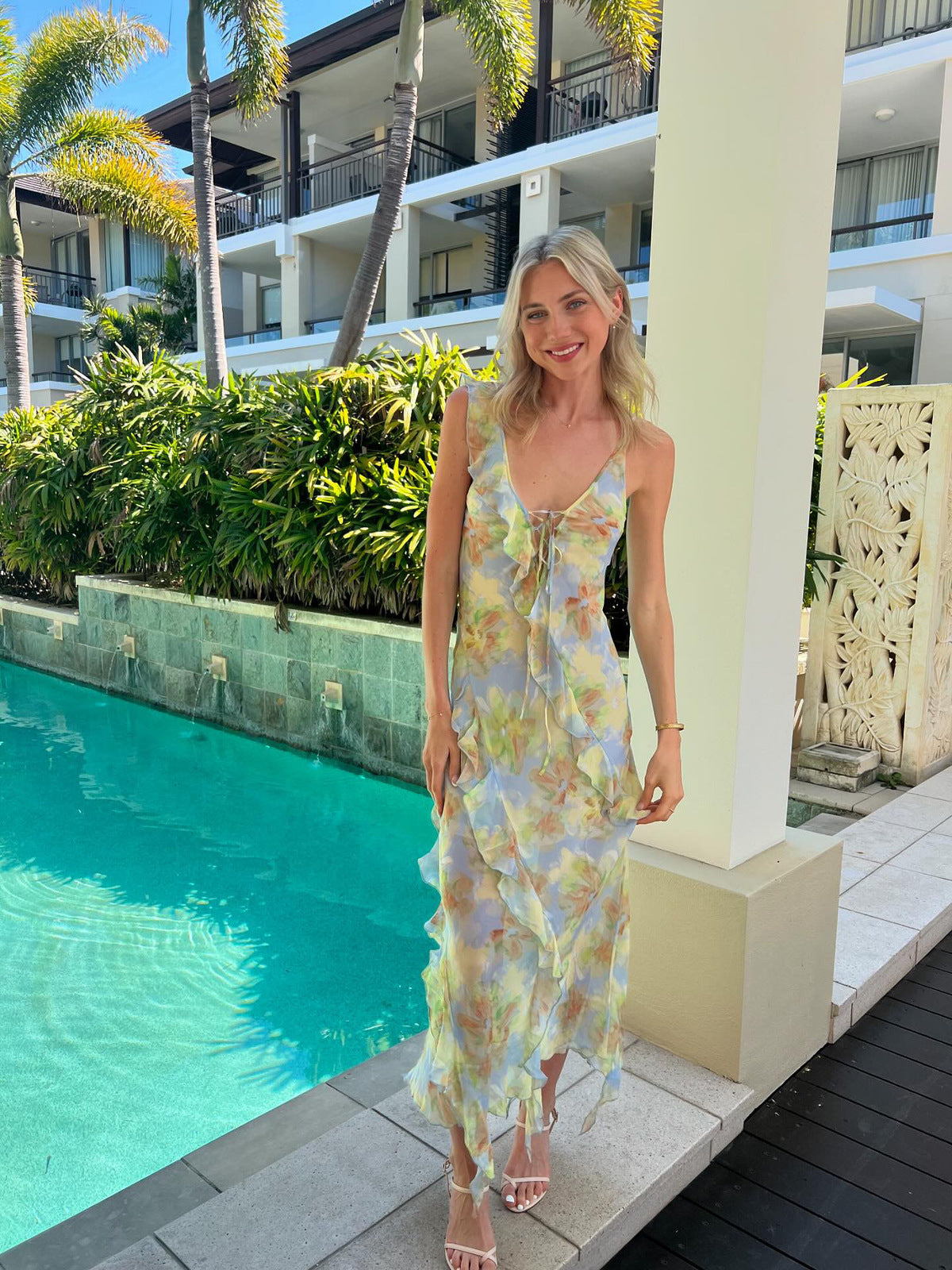 Crafted from lustrous silk print fabric and cut on the bias, the Courtney Frill Maxi Dress by Bec + Bridge embodies sophisticated ease. This statement piece showcases a plunging V-neckline, asymmetrical raw-cut shoulder detail, and artfully placed raw-cut ruffles that create movement and visual interest. The lace-up front closure and open V-back add architectural intrigue, making this an ideal choice for those seeking refined elegance with contemporary edge.