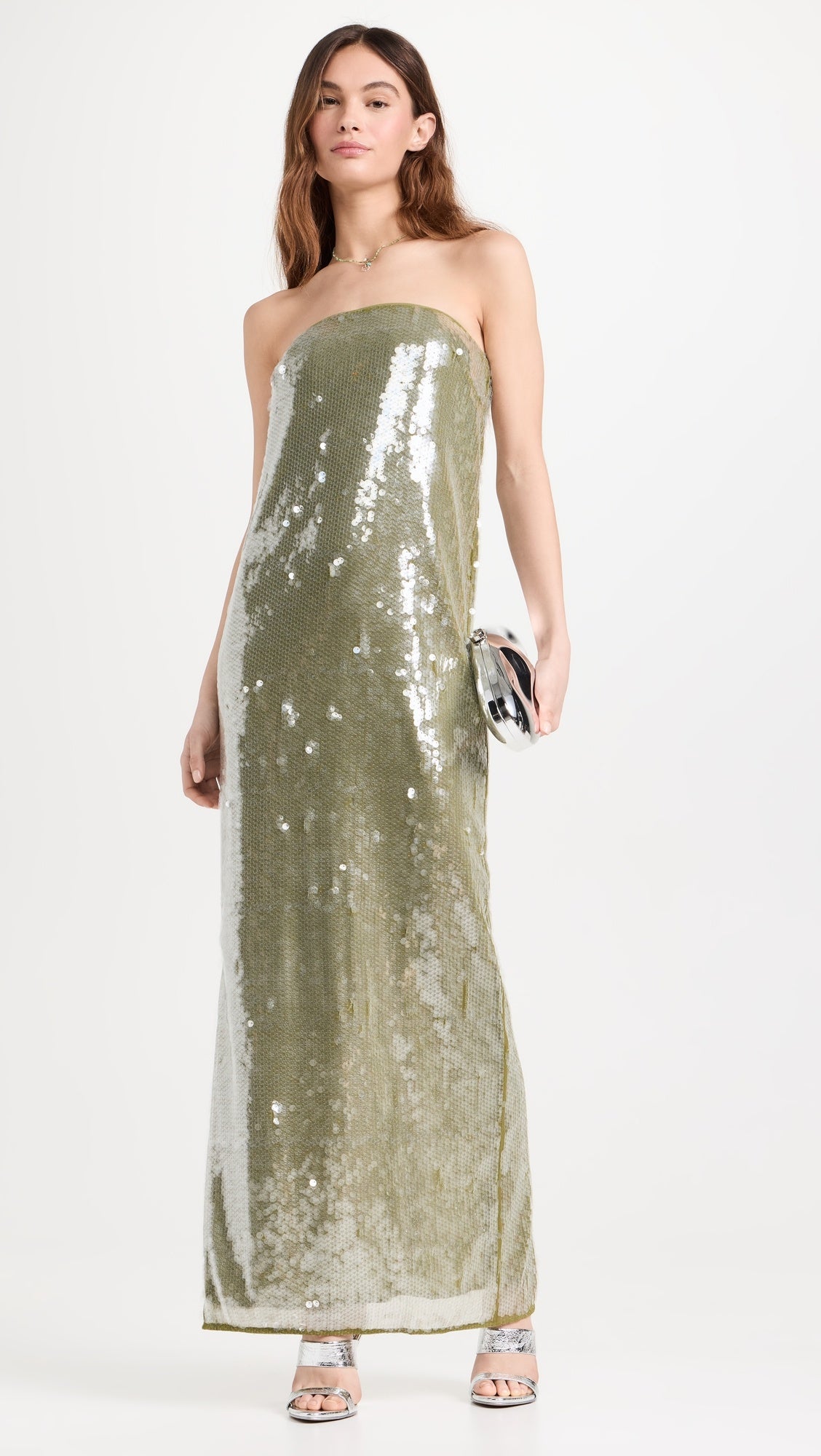 The Casey Dress by Staud combines contemporary elegance with practical sophistication. Crafted from mid-weight mesh, this strapless silhouette features allover iridescent paillette embellishments that catch light beautifully. The non-slip rubber binding ensures a secure fit, while the back slit adds movement and visual interest. Secured with a hidden zip and hook-and-eye closure for a seamless finish.