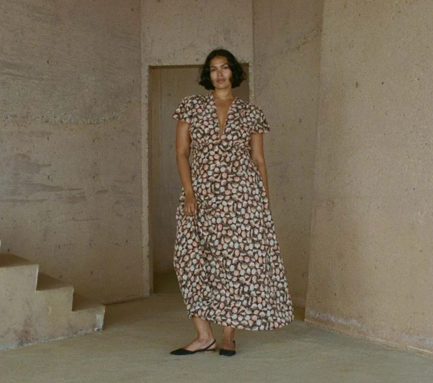 Crafted from luxurious sandwashed silk, this elegant maxi dress features a plunging V-neckline and delicate cap sleeves accented with contrasting scallop trim. The smocked shoulders and bust add refined texture, while the fitted bodice with an adjustable back tie creates a flattering silhouette. The bias-cut skirt gracefully skims the ankles, combining sophistication with effortless movement. Perfect for elevated occasions, the Adra Silk Maxi Dress exudes timeless charm.